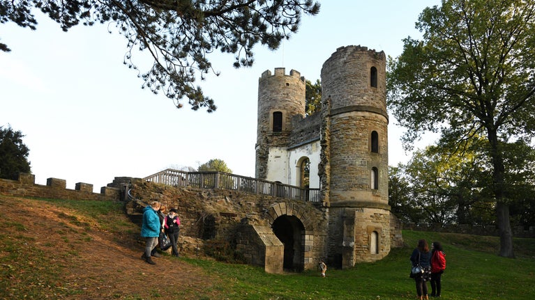 Visitors exploring the gothic folly 'Stainborough Castle' at Wentworth Castle, South Yorkshire
